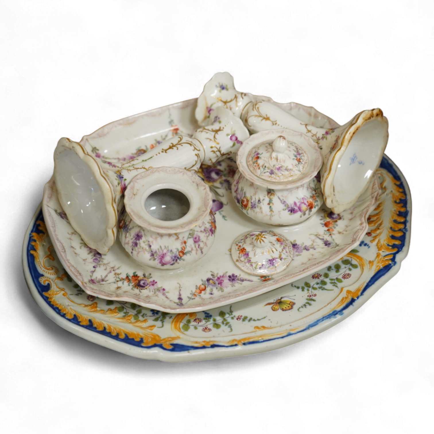 A late 19th century Dresden ink stand and a pair of candlesticks and a Nove faience dish